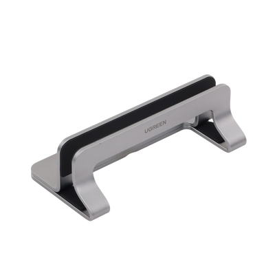 Soporte Vertical para Laptop / Adecuado para escritorio / Anchura Ajustable (12-26mm) / Amplia compatibilidad / Anti-Arañazos / Anti-Deslizante /Ajustable Mediante Tornillos / Color Plata / Aluminio + Silicona