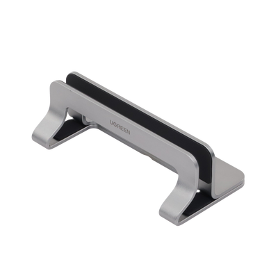 Soporte Vertical para Laptop / Adecuado para escritorio / Anchura Ajustable (12-26mm) / Amplia compatibilidad / Anti-Arañazos / Anti-Deslizante /Ajustable Mediante Tornillos / Color Plata / Aluminio + Silicona
